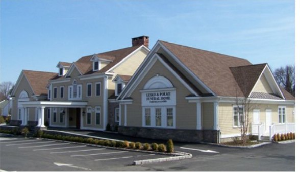 Lesko Funeral Home, a cream clapboard colonial building at 1209 Post Road in Fairfield Center, Connecticut, with its car park in front